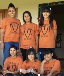 Residents of Nanny's Casa wearing t-shirts with Experanza Viva! cattle brand of the Living Hope For Honduras Farm.
